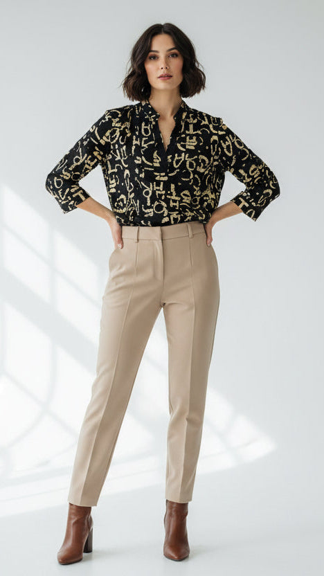 Femme NO AGE chemisier blouse with vibrant graffiti print, showcasing a stylish and modern design.