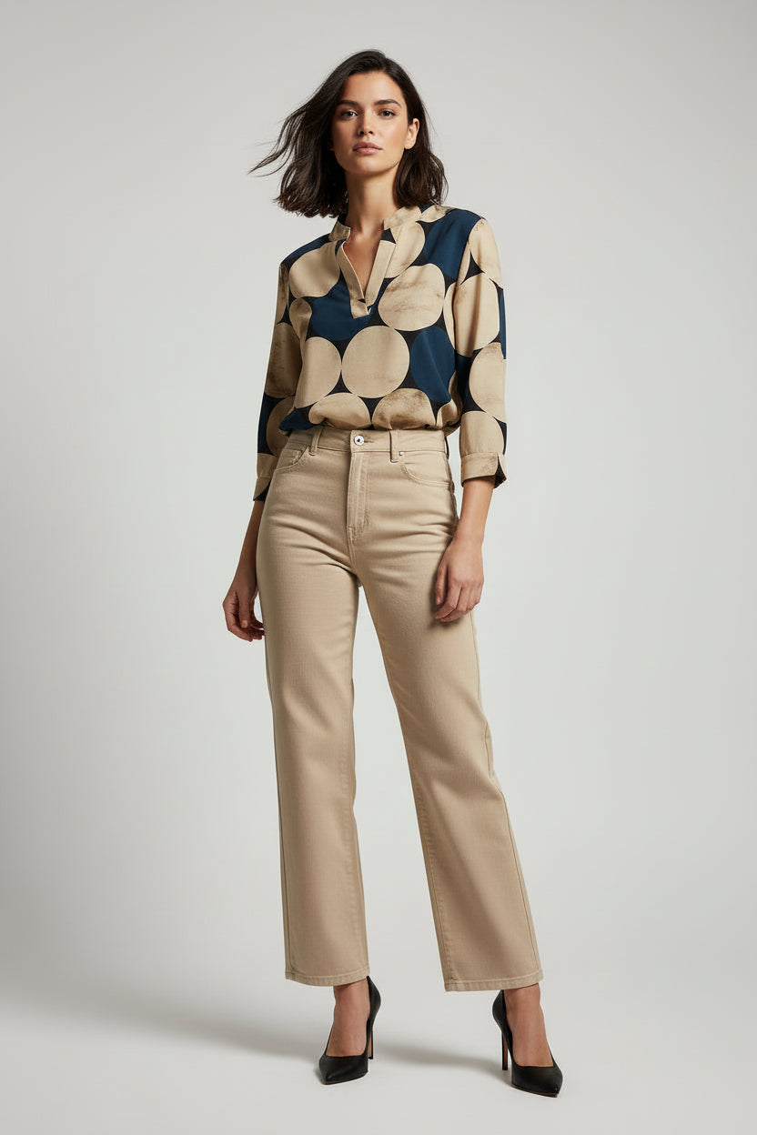 Stylish NO AGE women's printed blouse with a rounded neckline and vibrant patterns on a light background.